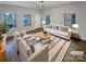 Staged living room with hardwood floors, natural light, and modern furniture at 120 Cadbury Ln, Fort Mill, SC 29715