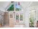 Bright bathroom with tile shower, large windows, and access to private outdoor space at 12011 Olden Ct, Charlotte, NC 28262
