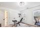 Bedroom featuring two windows and home workout station at 12011 Olden Ct, Charlotte, NC 28262