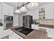 Contemporary kitchen featuring stainless steel appliances and white cabinetry at 12541 Willingdon Rd, Huntersville, NC 28078