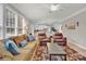 Inviting living room featuring a large window, comfortable seating, and seamless open floorplan at 12541 Willingdon Rd, Huntersville, NC 28078