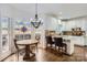 Breakfast nook features a bay window, breakfast table, and a view into the kitchen at 131 Sardis Pointe Rd, Matthews, NC 28105