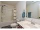 Cozy bathroom featuring a shower-tub combo, toilet, mirror, and a vanity with a sink at 133 Batten Ridge Dr, Statesville, NC 28677