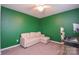 Neutral carpeted bedroom featuring a cozy couch and stylish modern desk at 133 Batten Ridge Dr, Statesville, NC 28677