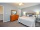 Bedroom showcasing a dresser, carpeted floors, a bed, and a mirror, creating a comfortable space at 133 Batten Ridge Dr, Statesville, NC 28677