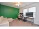 Bright bedroom features a ceiling fan, natural light, and a functional desk area at 133 Batten Ridge Dr, Statesville, NC 28677