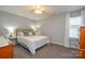 Bedroom with a bed, carpeted floors, bedside tables, and natural light from a window at 133 Batten Ridge Dr, Statesville, NC 28677