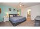 Bedroom showcasing a comfortable bed, carpeted floors, and access to an ensuite bathroom at 133 Batten Ridge Dr, Statesville, NC 28677