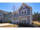 Beautiful two-story home with blue siding, stone accents, and a well-maintained front lawn at 133 Batten Ridge Dr, Statesville, NC 28677