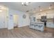 Modern kitchen featuring a center island with seating, pendant lighting, and stainless steel appliances at 133 Batten Ridge Dr, Statesville, NC 28677