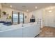 Bright, spacious living room featuring hardwood floors, neutral decor, a large window, and modern touches at 133 Batten Ridge Dr, Statesville, NC 28677