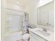 Bathroom featuring a bathtub, a shower curtain, and a mirror at 1444 Harleston St, Indian Trail, NC 28079