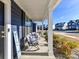 Cozy front porch furnished with comfortable seating, offering a relaxing outdoor space with neighborhood views at 1444 Harleston St, Indian Trail, NC 28079