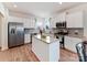 Modern kitchen with stainless steel appliances, granite countertops, and a central island at 1444 Harleston St, Indian Trail, NC 28079