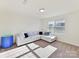 Inviting living room area featuring plush sectional sofa with bright natural light at 1444 Harleston St, Indian Trail, NC 28079