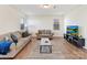 Comfortable living room with hardwood floors, neutral tones, and ample natural light at 1444 Harleston St, Indian Trail, NC 28079