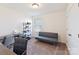 Functional office space with desk, futon, shelving, and natural light from a window at 1444 Harleston St, Indian Trail, NC 28079