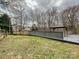 Overlooking the backyard is a large deck with a pergola, perfect for outdoor dining and relaxing at 14621 Sapphire Ln, Pineville, NC 28134