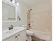 Bathroom with single vanity sink, tile floors, shower, and a toilet at 14621 Sapphire Ln, Pineville, NC 28134