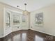 Bright breakfast nook featuring hardwood floors and large windows, perfect for morning relaxation at 14621 Sapphire Ln, Pineville, NC 28134