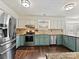 Well-equipped kitchen featuring stainless steel appliances, granite countertops, and modern cabinetry at 14621 Sapphire Ln, Pineville, NC 28134