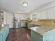 Spacious kitchen featuring updated stainless steel appliances, granite countertops, and ample storage at 14621 Sapphire Ln, Pineville, NC 28134