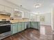 Well-lit kitchen offering stainless steel appliances, modern finishes, and a convenient layout at 14621 Sapphire Ln, Pineville, NC 28134