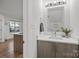 Bathroom with large mirror, great lighting, quartz countertop, and modern vanity at 1503 Briar Creek Rd # Apt B, Charlotte, NC 28205