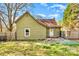 View of the home's exterior with a fenced backyard, and a grassy area, perfect for outdoor activities at 1759 Smith Ave, Gastonia, NC 28052