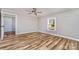 Bright bedroom features modern wood-look floors and a ceiling fan at 1759 Smith Ave, Gastonia, NC 28052