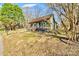 Quaint home with a welcoming front porch, surrounded by mature trees and a spacious yard at 1759 Smith Ave, Gastonia, NC 28052
