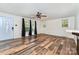 Open-concept living room with wood-look flooring, neutral walls, and ample natural light at 1759 Smith Ave, Gastonia, NC 28052