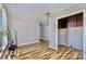 Versatile room with wood-look floors, neutral walls, and ample closet space at 1759 Smith Ave, Gastonia, NC 28052