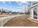 This backyard includes a charming white picket fence, adding privacy to this outdoor space at 2032 Country Pl, Hickory, NC 28601