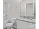 Well-lit bathroom featuring a granite countertop, tub and shower combination at 2032 Country Pl, Hickory, NC 28601