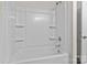 Bathroom featuring a white bathtub with shower and a large mirror at 2032 Country Pl, Hickory, NC 28601