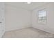 Inviting bedroom featuring soft carpet, natural light through the window, and a cozy ambiance at 2032 Country Pl, Hickory, NC 28601