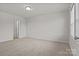 A neutral bedroom featuring carpet, natural light, and neutral paint at 2032 Country Pl, Hickory, NC 28601
