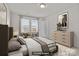 Neutral bedroom featuring a large window, a bed, and a dresser at 2032 Country Pl, Hickory, NC 28601