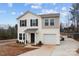 Charming two-story home with neutral siding, black shutters, an attached garage, and a well-manicured lawn at 2032 Country Pl, Hickory, NC 28601