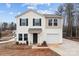 Charming two-story home with neutral siding, black shutters, and an attached one car garage at 2032 Country Pl, Hickory, NC 28601