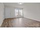 Bright and airy living room with wood-look flooring, neutral walls, and natural light at 2032 Country Pl, Hickory, NC 28601