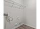 Utility room featuring hookups, a wire shelf, and wood-look flooring at 2032 Country Pl, Hickory, NC 28601