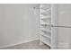 A bright walk-in closet featuring adjustable shelving for optimal storage and organization at 2032 Country Pl, Hickory, NC 28601