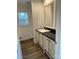 Bathroom featuring a vanity with hard surface floors and a window for natural light at 238 Fairchase Cir # 54, Stony Point, NC 28678