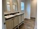 Modern bathroom with double sinks, sleek countertops, and a large mirror, with a tiled floor at 238 Fairchase Cir # 54, Stony Point, NC 28678