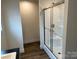 Modern bathroom featuring a glass-enclosed shower, providing a sleek and functional design at 238 Fairchase Cir # 54, Stony Point, NC 28678