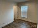 Bedroom featuring hard surface floors and a window providing natural light at 238 Fairchase Cir # 54, Stony Point, NC 28678