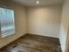 Bedroom with hard surface floors and a window offering natural light at 238 Fairchase Cir # 54, Stony Point, NC 28678