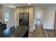 Bright kitchen showcasing stainless steel appliances and ample cabinet space, seamlessly connected to a hallway at 238 Fairchase Cir # 54, Stony Point, NC 28678